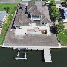 Installation-of-a-New-Vinyl-Seawall-and-Concrete-Cap-Dock-with-Vinyl-Decking-and-Hurricane-Boat-Lift-24000lb-with-Piles 0